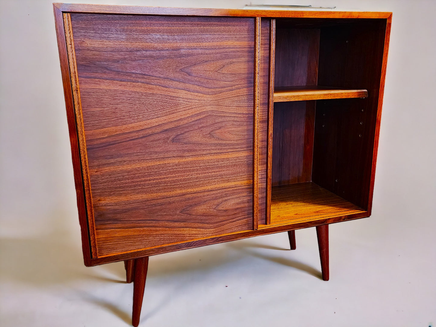 REFINISHED MCM walnut cabinet w sliding doors, narrow, fits records 37.5”