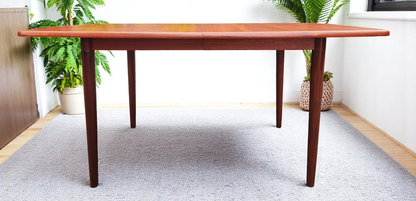 REFINISHED MCM Boat Shaped Teak Table Self storing w 2 Leaves by G. Bahus 63"-96"