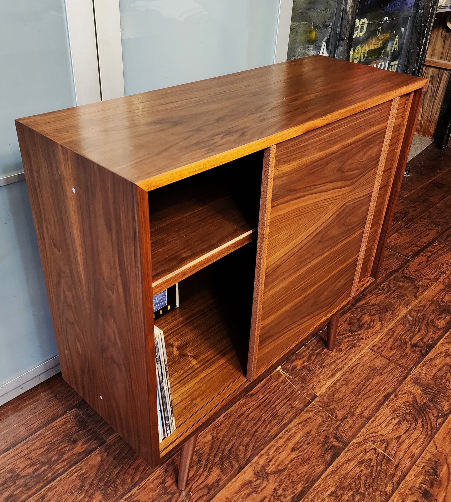 REFINISHED MCM walnut cabinet w sliding doors, narrow, fits records 37.5”