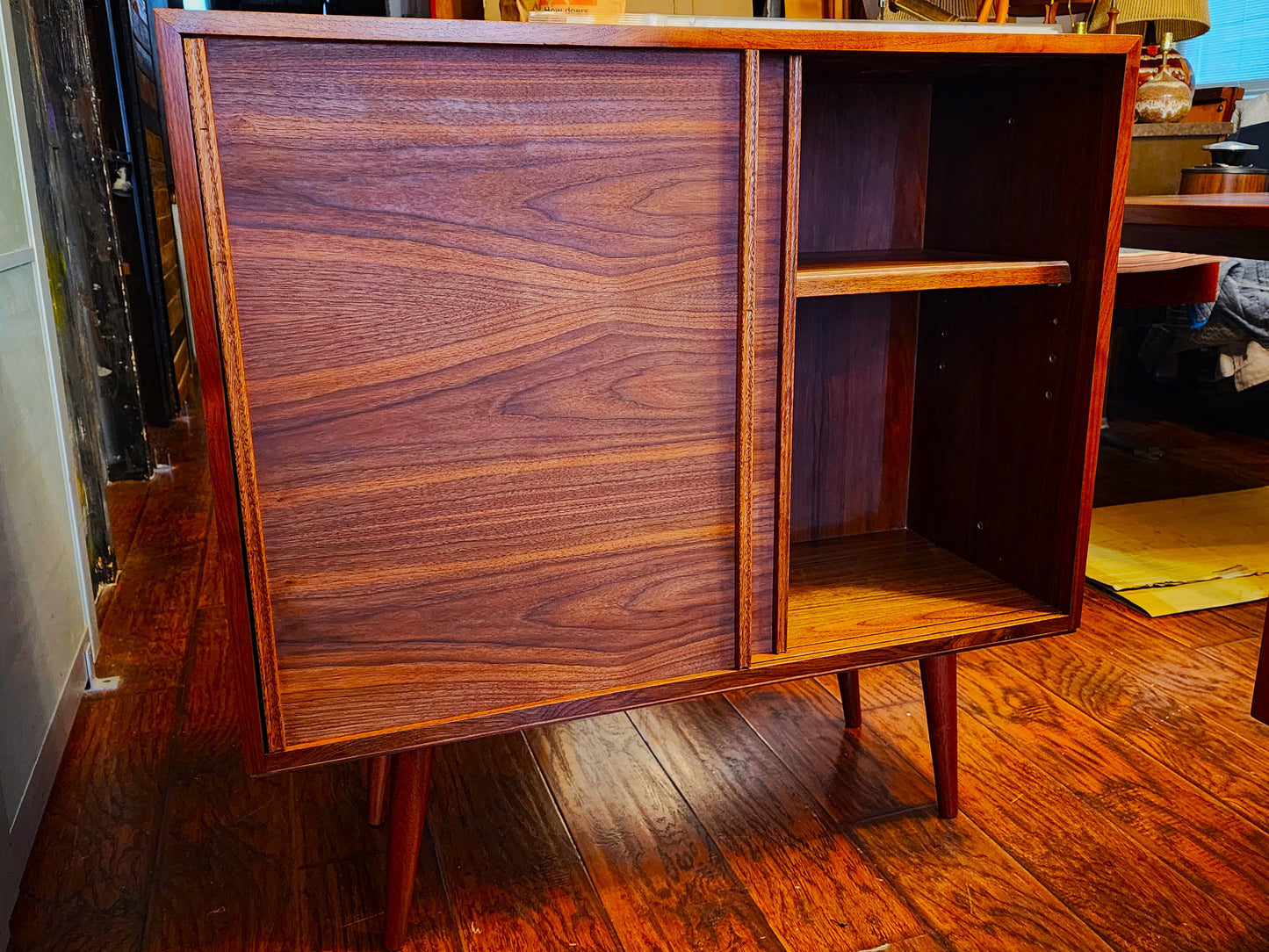 REFINISHED MCM walnut cabinet w sliding doors, narrow, fits records 37.5”