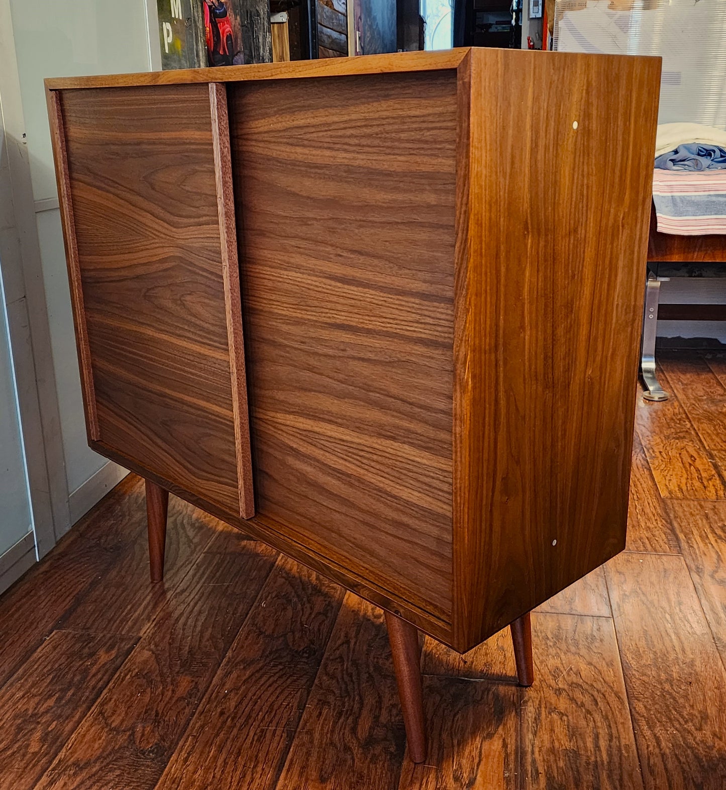 REFINISHED MCM walnut cabinet w sliding doors, narrow, fits records 37.5”