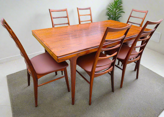 Danish MCN draw leaf rosewood table by Johannes Andersen 63"-102" & 6 Lis chairs by Niels Kofoed