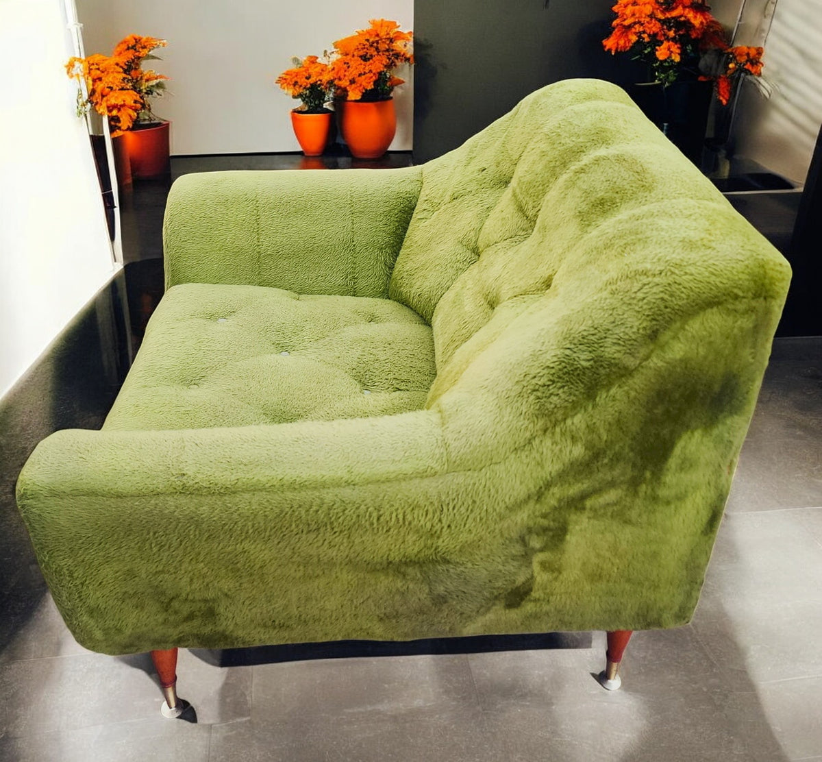 Mid Century Modern armchair with green faux fur upholstery
