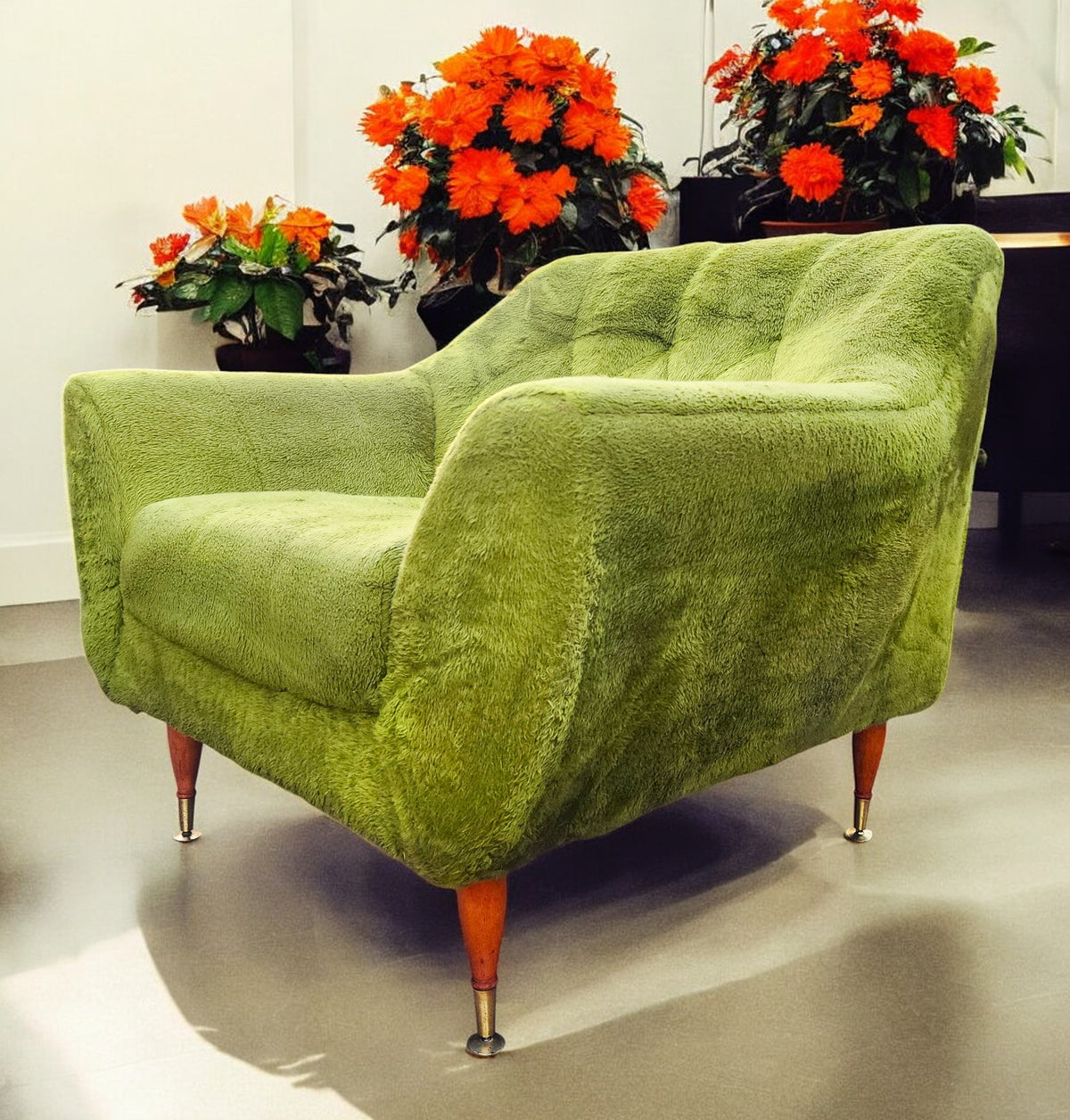 Mid Century Modern armchair with green faux fur upholstery