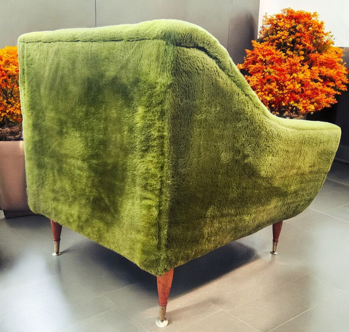 Mid Century Modern armchair with green faux fur upholstery