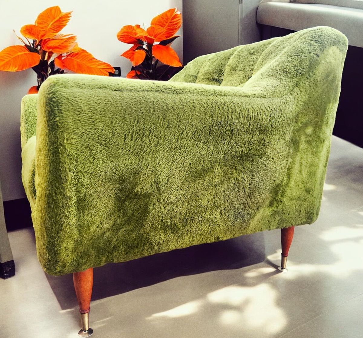 Mid Century Modern armchair with green faux fur upholstery