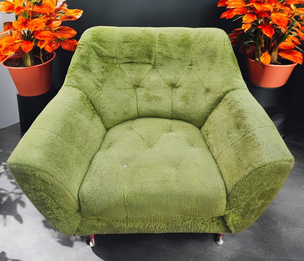 Mid Century Modern armchair with green faux fur upholstery