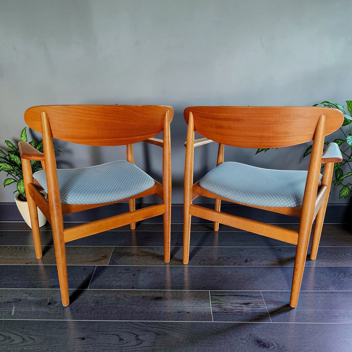 Mid Century Modern Toronto Danish teak and oak armchairs with blue patterned upholstery in a minimalist dining room