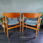 Mid Century Modern Toronto Danish teak and oak armchairs with blue patterned upholstery in a minimalist dining room 13
