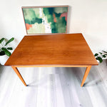 Mid Century Modern Toronto refinished Danish teak and oak dining table with tapered legs in a bright home setting 4