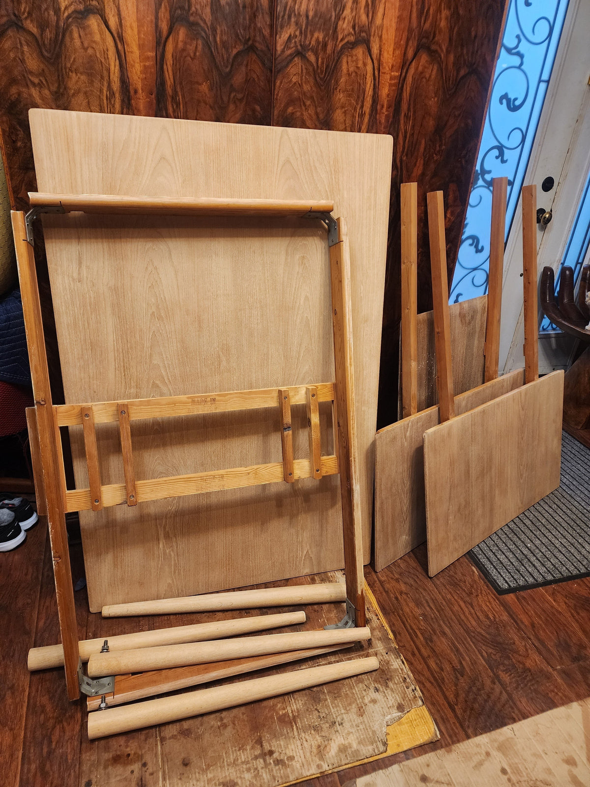 Mid Century Modern Toronto disassembled Danish teak and oak dining table parts including tabletop, leaves, and legs.