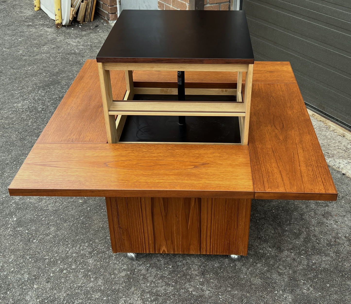 REFINISHED MCM Rolling Teak Coffee Table w Hydraulic Pop-Up Bar by Kai Kristiansen