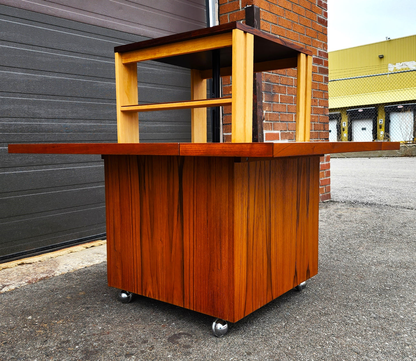 REFINISHED MCM Rolling Teak Coffee Table w Hydraulic Pop-Up Bar by Kai Kristiansen