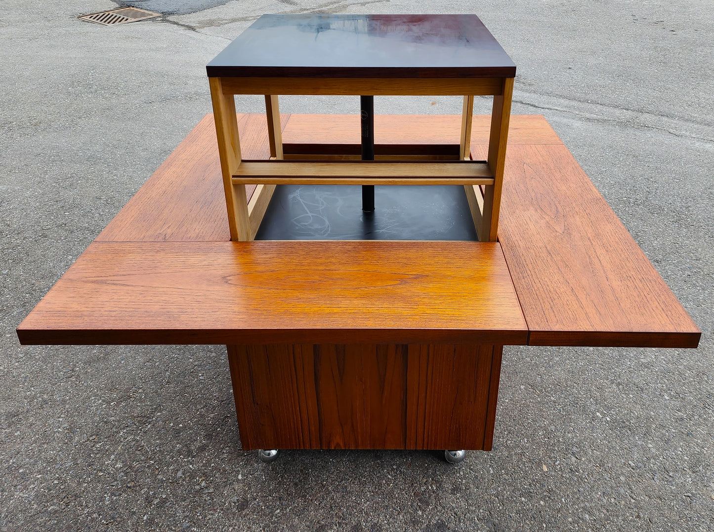 REFINISHED MCM Rolling Teak Coffee Table w Hydraulic Pop-Up Bar by Kai Kristiansen